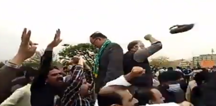 Shoe hurled at Ahsan Iqbal as PTI, PML-N workers clash in front of parliament house