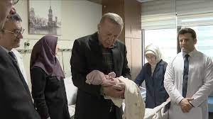 Turkish President recites “call to prayer” in ears of newborn girl