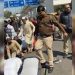 Delhi: Indian cop brutally beats Muslim men offering Friday prayer on roadside